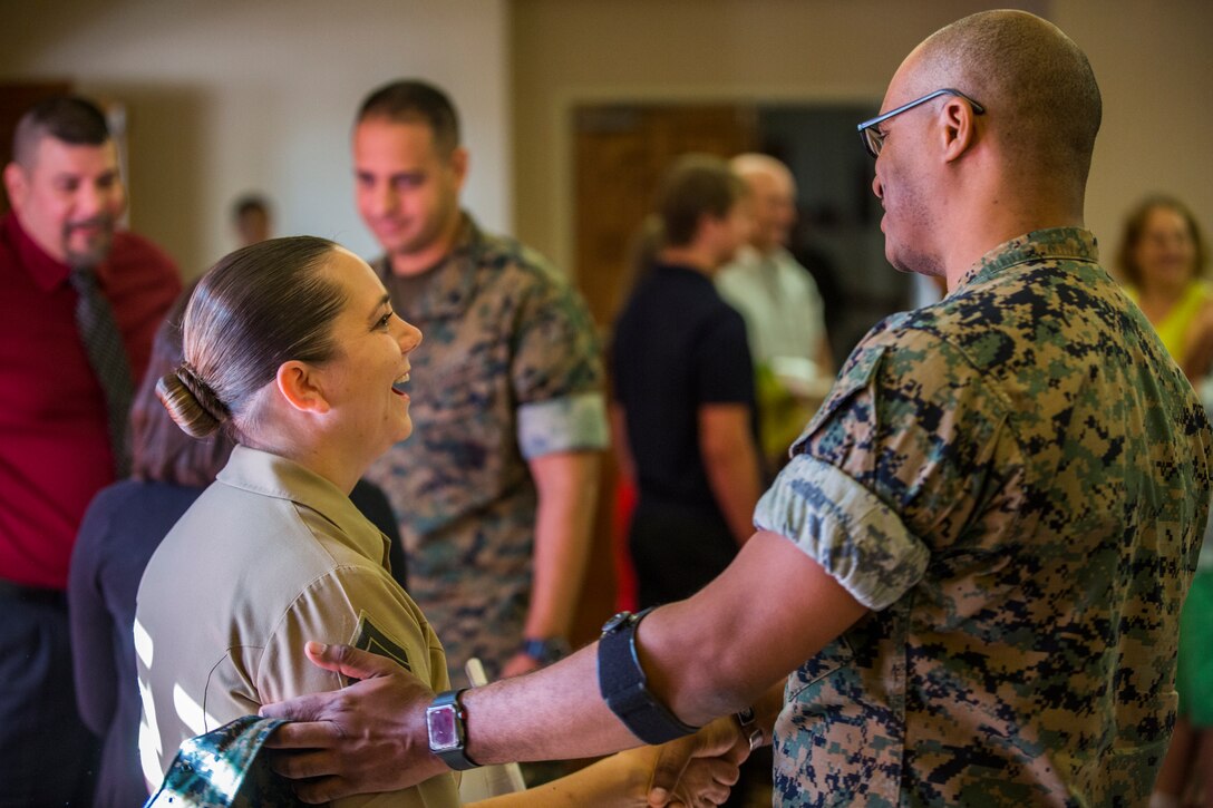 U.S. Marine Corps Staff Sgt. Nicole Showman retires after 20 years of service at the Sonoran Pueblo on Marine Corps Air Station Yuma, Ariz., July 12, 2019. Showman also received a Navy-Marine Corps Achievment Medal for her superior performance as the Headquarters and Headquarters Squadron Career Planner from June 2018 to July 2019. (U.S. Marine Corps photo by Cpl. Sabrina Candiaflores)