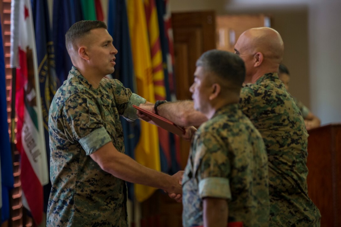 U.S. Marine Corps Gunnery Sgt. Jeremiah W. Francis retires after 20 years of service at the Sonoran Pubelo on Marine Corps Air Station Yuma, Ariz., July 12, 2019. Francis served as the Quality Assurance Chief, Airframes Chief, Squadron Gunnery Sergeant, and Flight Equipment Chief and was assigned to Marine Operational Test and Evaluation Squadron (VMX) One. (U.S. Marine Corps photo by Sgt. Isaac D. Martinez)
