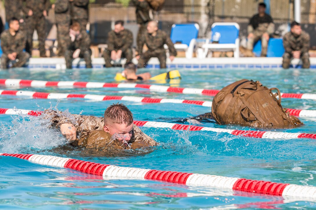 U.S. Marines stationed at Marine Corps Air Station (MCAS) Yuma conduct their swim qualification at the Oasis Pool on MCAS Yuma, Ariz., July 10, 2019. The swim qualification is designed to reduce fear, raise self-confidence, and develop Marines with the ability to survive in water. (U.S. Marine Corps photo by Cpl. Sabrina Candiaflores)