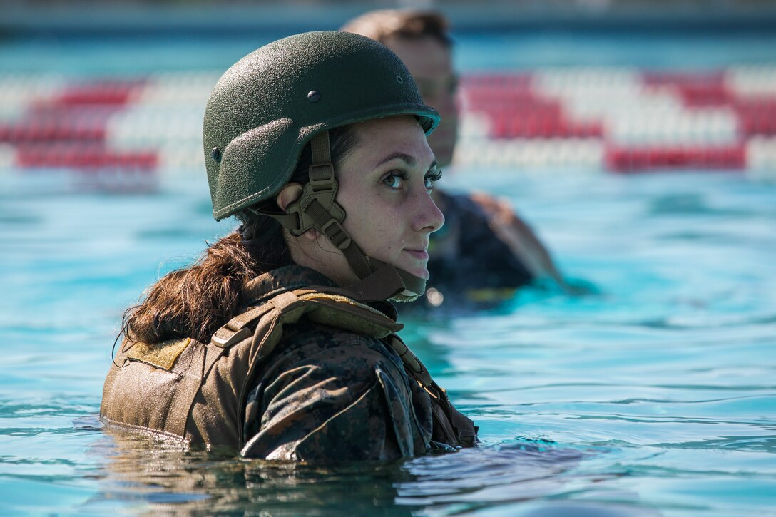 U.S. Marines stationed at Marine Corps Air Station (MCAS) Yuma conduct their swim qualification at the Oasis Pool on MCAS Yuma, Ariz., July 10, 2019. The swim qualification is designed to reduce fear, raise self-confidence, and develop Marines with the ability to survive in water. (U.S. Marine Corps photo by Cpl. Sabrina Candiaflores)
