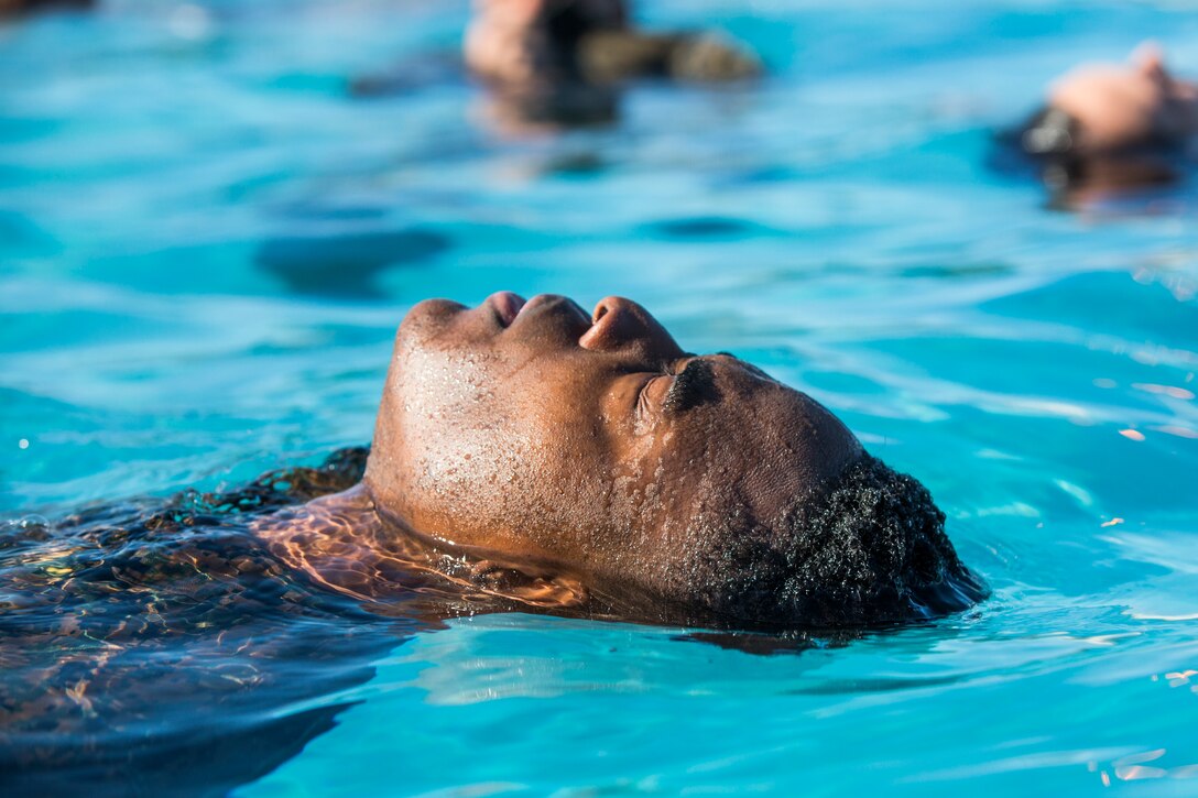 U.S. Marines stationed at Marine Corps Air Station (MCAS) Yuma conduct their swim qualification at the Oasis Pool on MCAS Yuma, Ariz., July 10, 2019. The swim qualification is designed to reduce fear, raise self-confidence, and develop Marines with the ability to survive in water. (U.S. Marine Corps photo by Cpl. Sabrina Candiaflores)