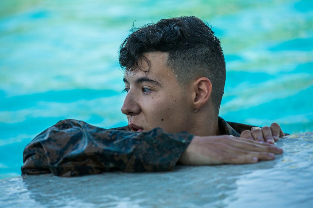U.S. Marines stationed at Marine Corps Air Station (MCAS) Yuma conduct their swim qualification at the Oasis Pool on MCAS Yuma, Ariz., July 10, 2019. The swim qualification is designed to reduce fear, raise self-confidence, and develop Marines with the ability to survive in water. (U.S. Marine Corps photo by Cpl. Sabrina Candiaflores)