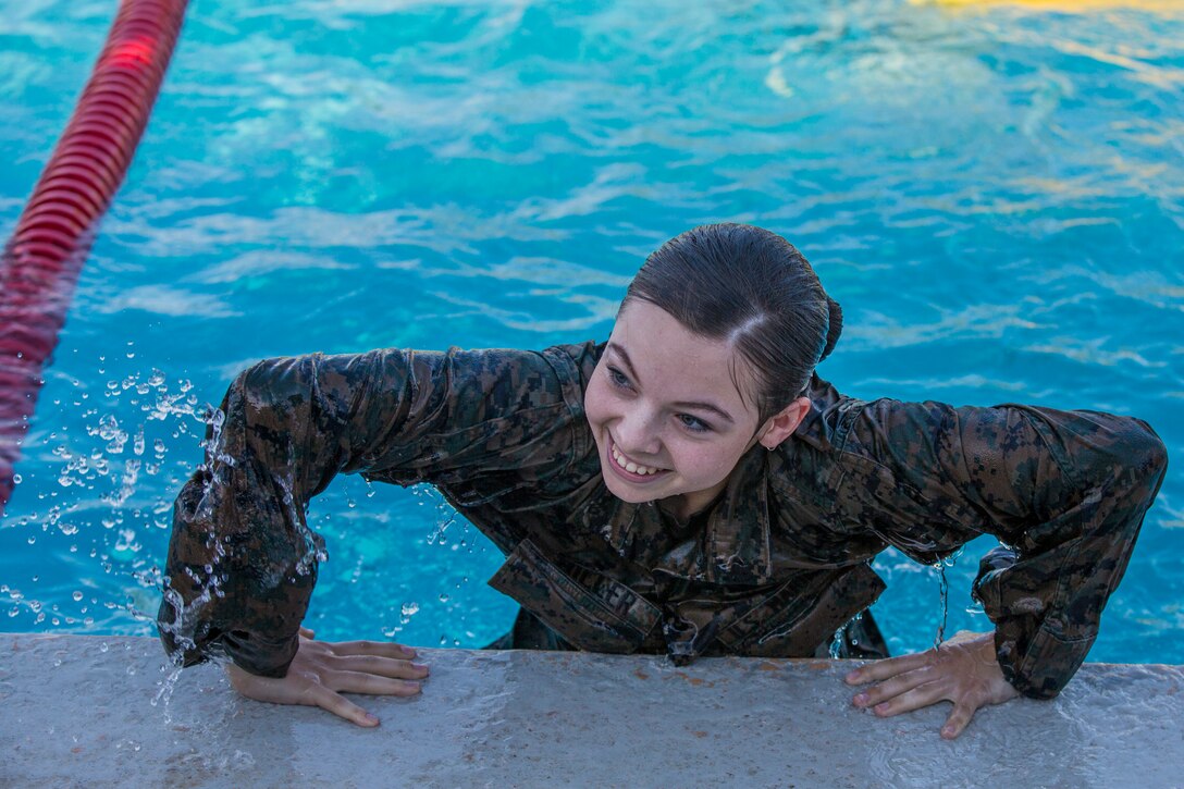 U.S. Marines stationed at Marine Corps Air Station (MCAS) Yuma conduct their swim qualification at the Oasis Pool on MCAS Yuma, Ariz., July 10, 2019. The swim qualification is designed to reduce fear, raise self-confidence, and develop Marines with the ability to survive in water. (U.S. Marine Corps photo by Cpl. Sabrina Candiaflores)