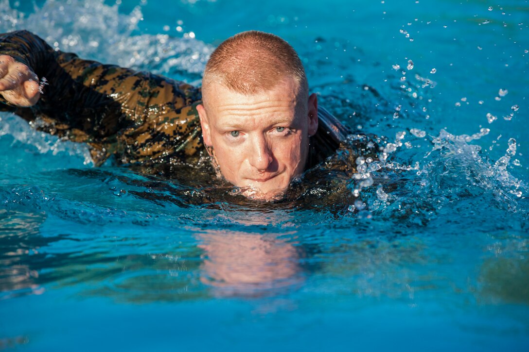 U.S. Marines stationed at Marine Corps Air Station (MCAS) Yuma conduct their swim qualification at the Oasis Pool on MCAS Yuma, Ariz., July 10, 2019. The swim qualification is designed to reduce fear, raise self-confidence, and develop Marines with the ability to survive in water. (U.S. Marine Corps photo by Cpl. Sabrina Candiaflores)