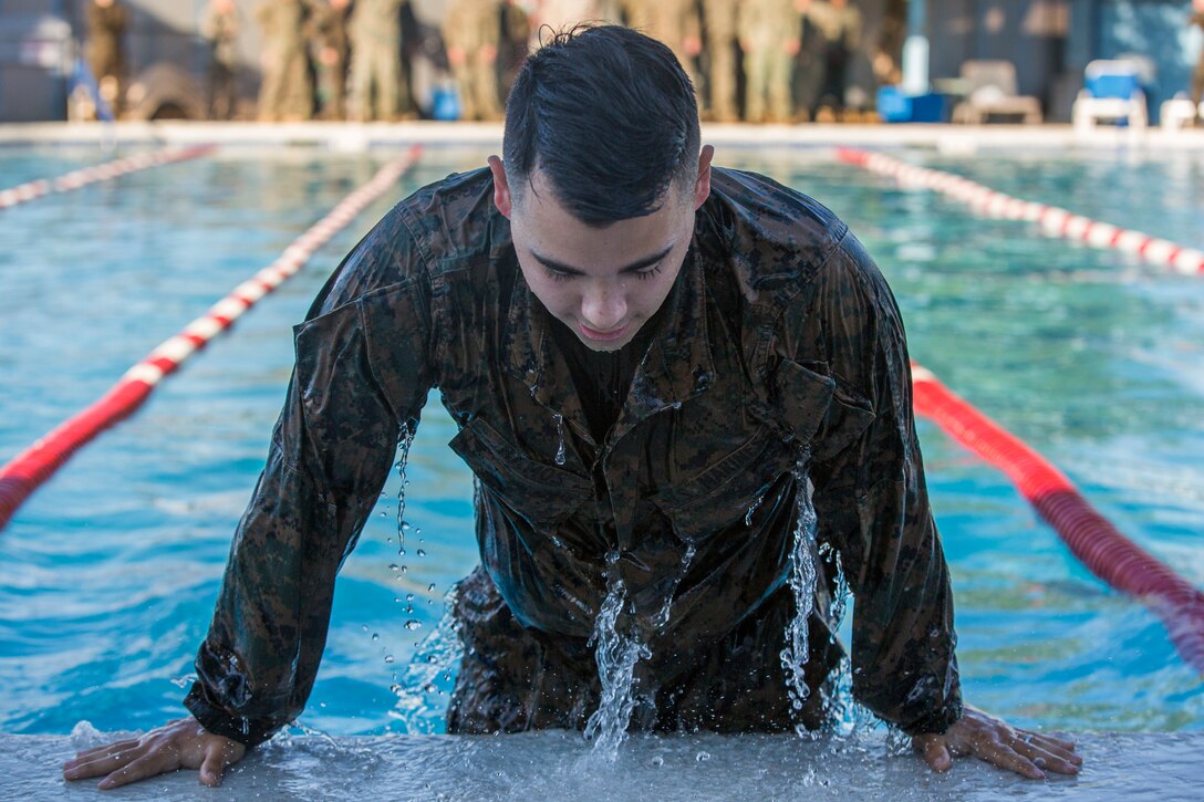U.S. Marines stationed at Marine Corps Air Station (MCAS) Yuma conduct their swim qualification at the Oasis Pool on MCAS Yuma, Ariz., July 10, 2019. The swim qualification is designed to reduce fear, raise self-confidence, and develop Marines with the ability to survive in water. (U.S. Marine Corps photo by Cpl. Sabrina Candiaflores)