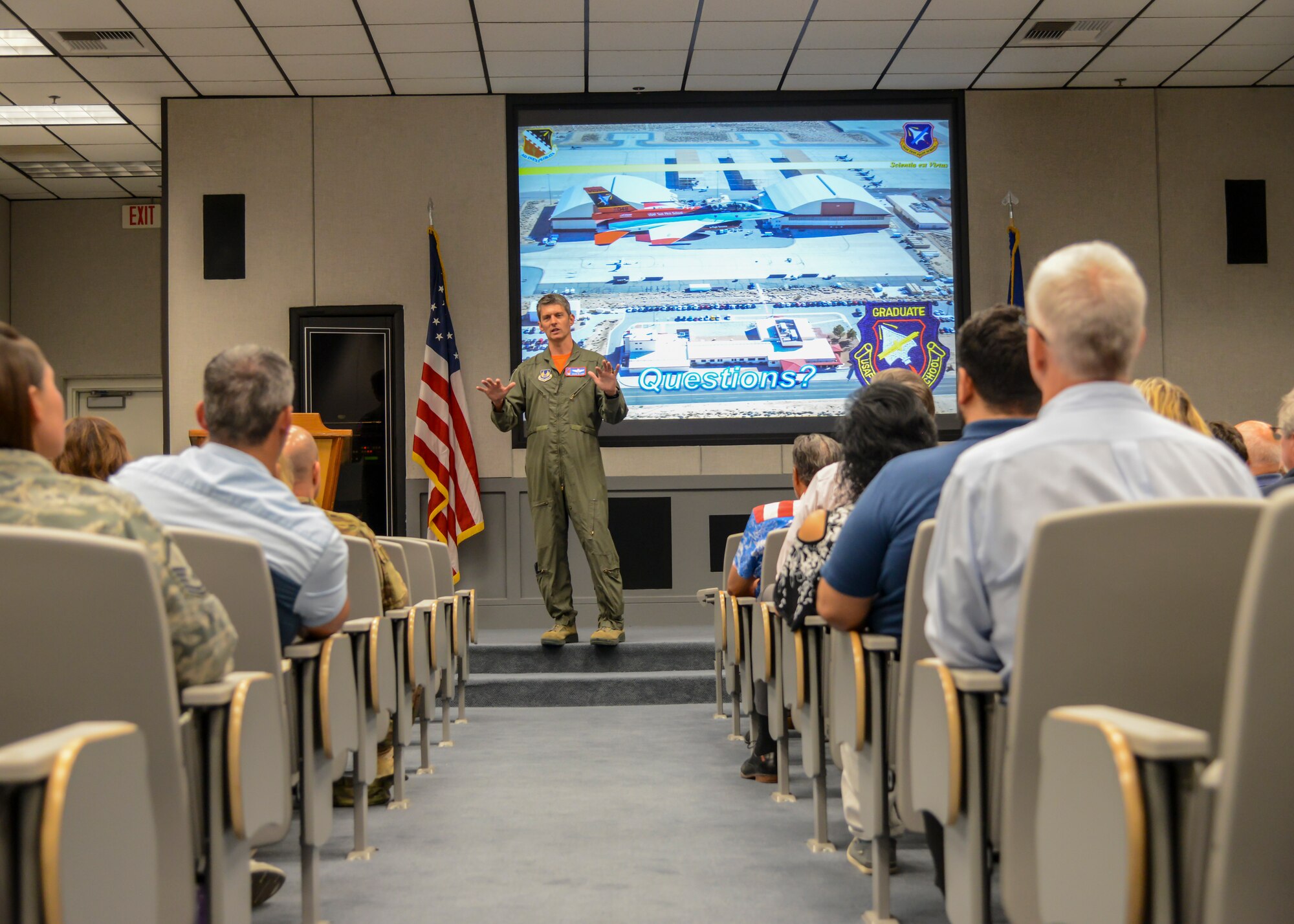 Col. Ryan Blake, U.S. Air Force Test Pilot School Commandant, provides a mission brief to the current group of Honorary Commanders at Edwards Air Force Base, Calif., July 19. The Honorary Commander program is a two-year appointment that partners base commanders with local civic, educational and business leaders to enhance and promote a mutual relationship between the base and the local community. (U.S. Air Force photo by Giancarlo Casem)