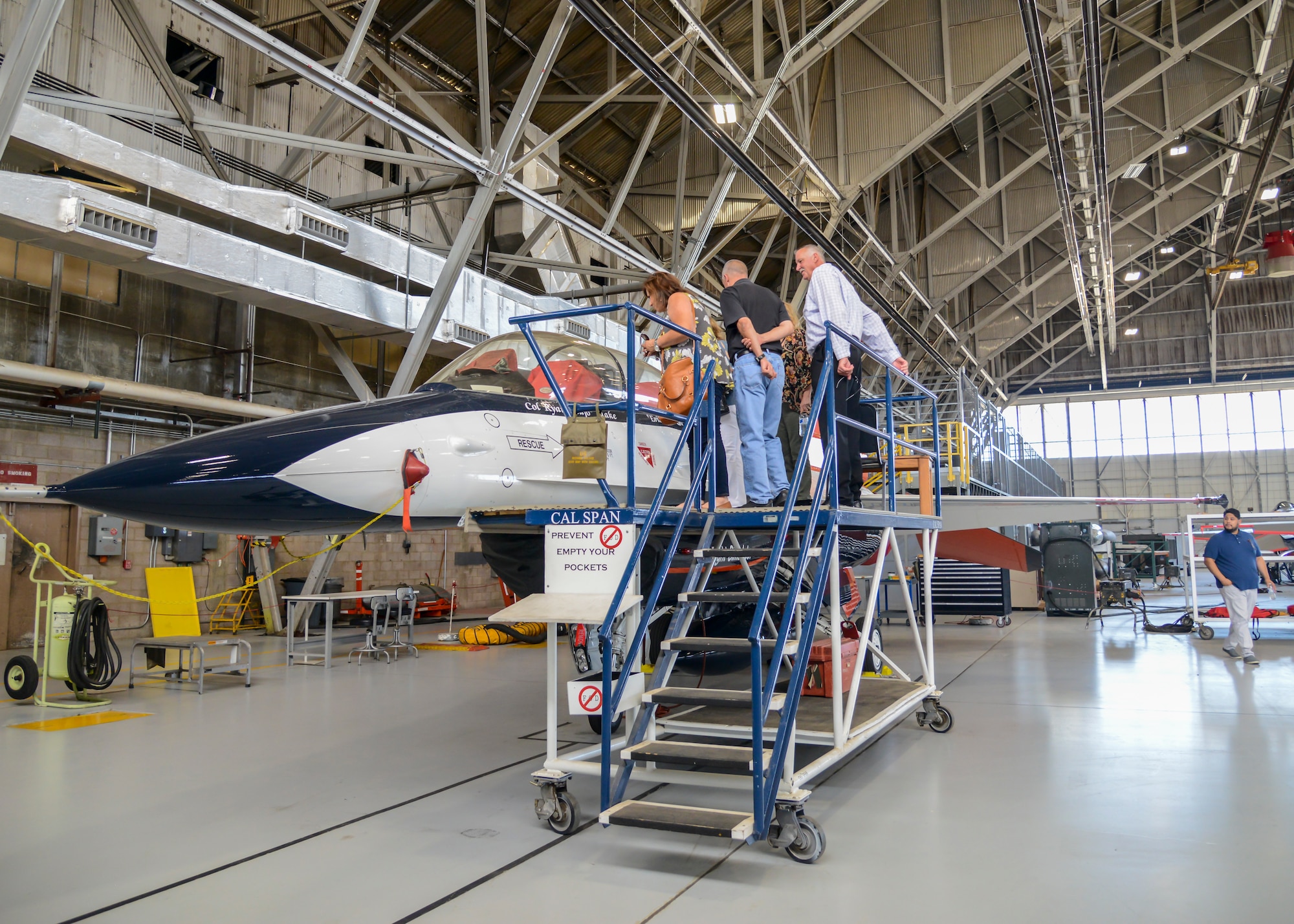 A group of Edwards Honorary Commanders get a look at a U.S. Air Force Test Pilot School Calspan VISTA F-16 aircraft at Edwards Air Force Base, Calif., July 19. The VISTA serves as an in-flight simulator for Test Pilot School personnel. (U.S. Air Force photo by Giancarlo Casem)