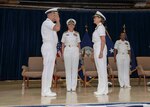AGANA HEIGHTS, Guam (July 23, 2019) Rear Adm. John Menoni, left, assumes command of Joint Region Marianas from Rear Adm. Shoshana Chatfield during a change of command ceremony at the Guam High School gymnasium in Agana Heights July 23. Chatfield served as JRM commander from 2017 to 2019 and will report to the Naval War College in Newport, Rhode Island, where she will serve as president.