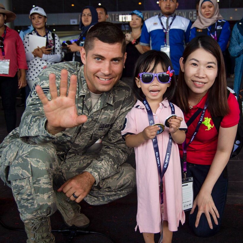 SSgt Andy Detra connects with audience members following a performance in Malaysia.