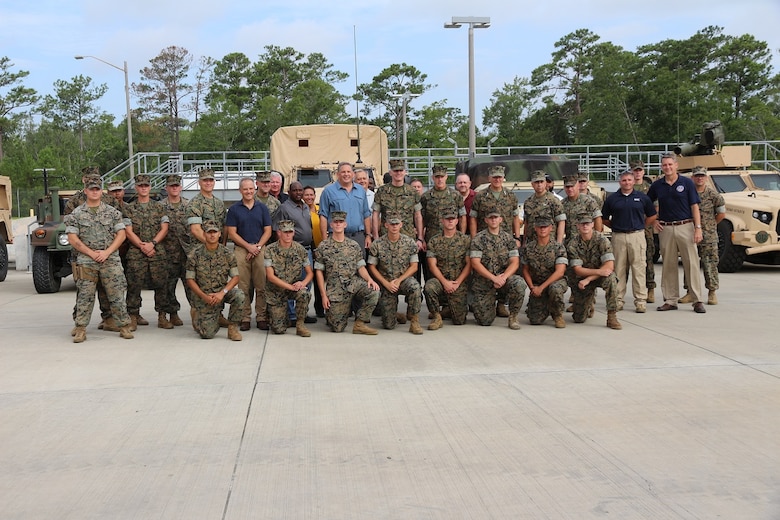 James Geurts, assistant secretary of the Navy for Research, Development and Acquisition, Assistant Commandant of the Marine Corps Gen. Gary Thomas, Deputy Commandant for Installations and Logistics Lt. Gen. Charles Chiarotti, Deputy Director for Integrated Warfare Michael Stewart, Program Executive Officer Land Systems John Garner and Marine Corps Systems Command Brig. Gen. Arthur Pasagian toured the II Marine Expeditionary Force JLTV fielding site and spoke to Marines July 18 in an event aboard Camp Lejeune, 2019. (U.S. Marine Corps photo by Ashley Calingo)