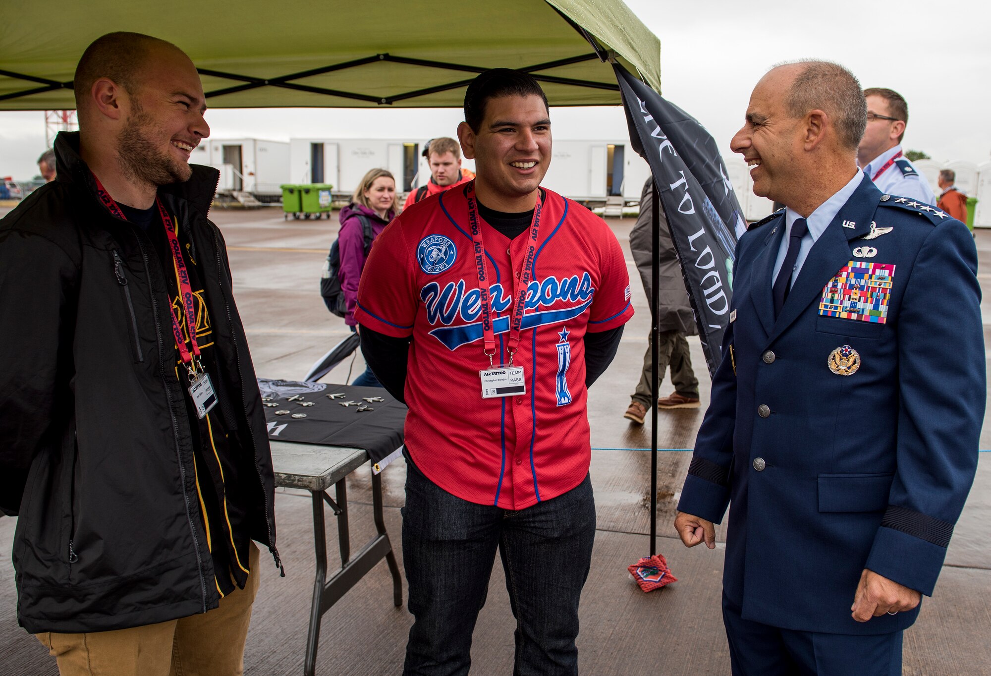 U.S. Air Force Senior Airman Ryan Golden, 48th Aircraft Maintenance Squadron support technician, and Christopher Morejon, 48th Maintenance Group weapons lead load crew member, meet Gen. Jeff Harrigian, U.S. Air Forces in Europe and Air Forces Africa commander, during the 2019 Royal International Air Tattoo at RAF Fairford, England, July 19, 2019. This year’s RIAT commemorated the 70th anniversary of NATO and highlighted the United States’ enduring commitment to its European allies. (U.S. Air Force photo by Airman 1st Class Jennifer Zima)