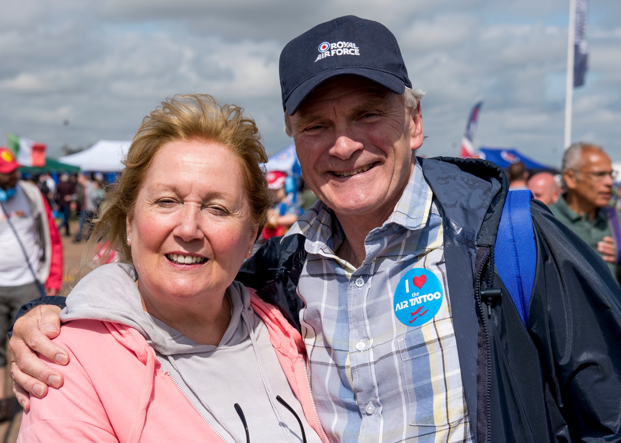 Squadron leader Clive Wood, RAF Alconbury and RAF Molesworth RAF commander, and partner Clare Lawrence, pose for a photo during the 2019 Royal International Air Tattoo at RAF Fairford, England, July 20, 2019. RAF Alconbury, RAF Molesworth and RAF Fairford make up three of the seven bases under the control of the U.S. Air Force’s 501st Combat Support Wing. (U.S. Air Force photo by Airman 1st Class Jennifer Zima)