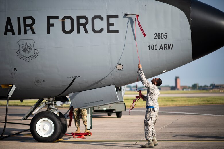 U.S. Air Force Airman Nizir Santiago, 100th Aircraft Maintenance Squadron crew chief, prepares a KC-135 Stratotanker for a flight supporting Operation Rapid Forge at RAF Mildenhall, England, July 23, 2019. Rapid Forge is a U.S. Air Forces in Europe-sponsored training event designed to enhance interoperability with NATO allies and partners, improve readiness and sharpen operational capabilities. (U.S. Air Force photo by Tech. Sgt. Emerson Nuñez)