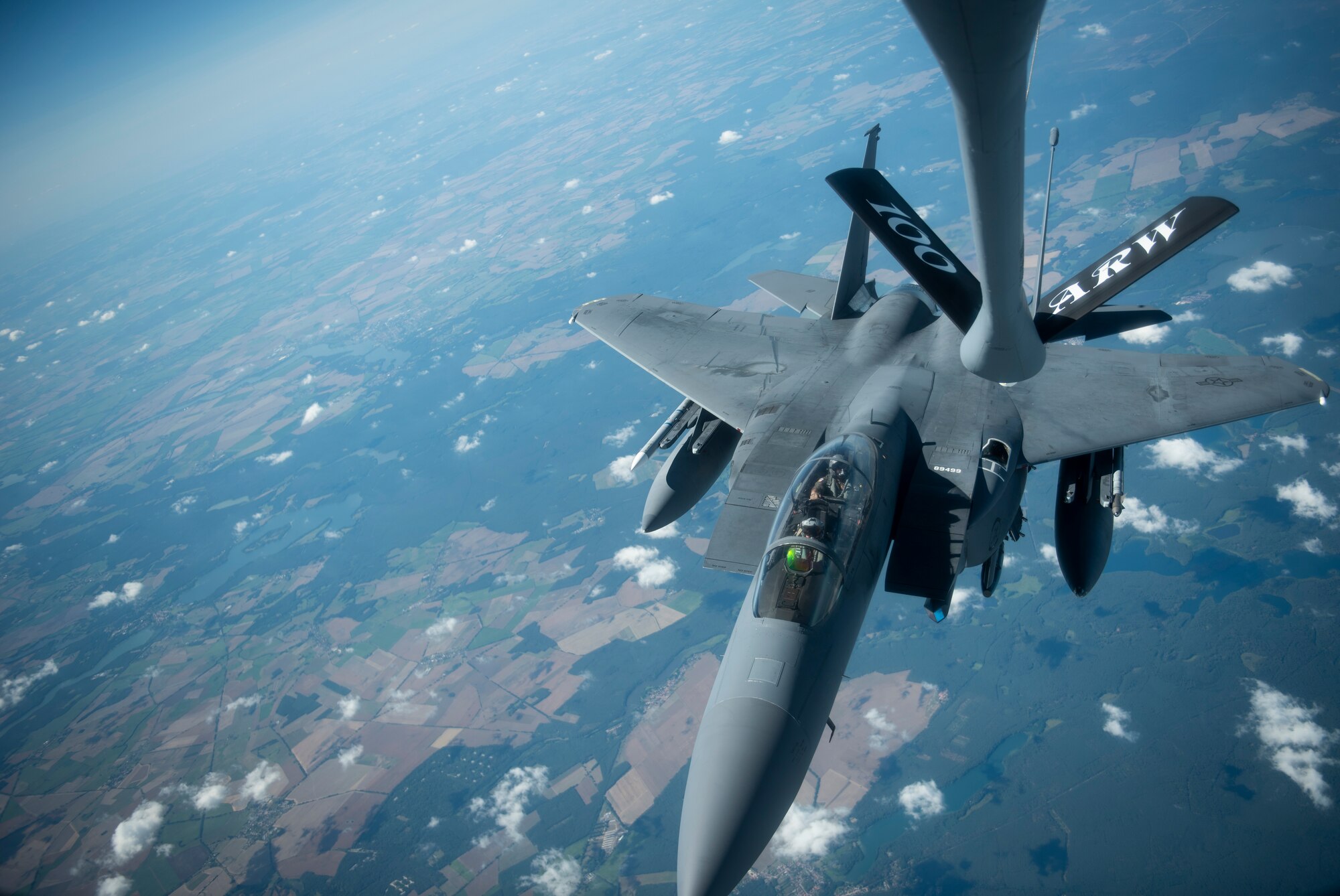 A U.S. Air Force F-15E Strike Eagle, assigned to the 4th Fighter Wing, Seymour Johnson Air Force Base, North Carolina, approaches a KC-135 Stratotanker assigned to the 351st Air Refueling Squadron, RAF Mildenhall, England, to receive fuel during Operation Rapid Forge over Germany, July 23, 2019. Rapid Forge is a U.S. Air Forces in Europe-sponsored training event designed to enhance interoperability with NATO allies and partners, improve readiness and sharpen operational capabilities. (U.S. Air Force photo by Tech. Sgt. Emerson Nuñez)