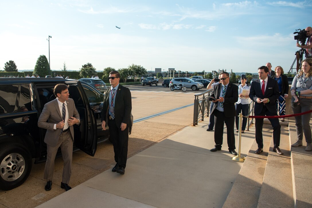 Defense Secretary Dr. Mark T. Esper gets out of a car.