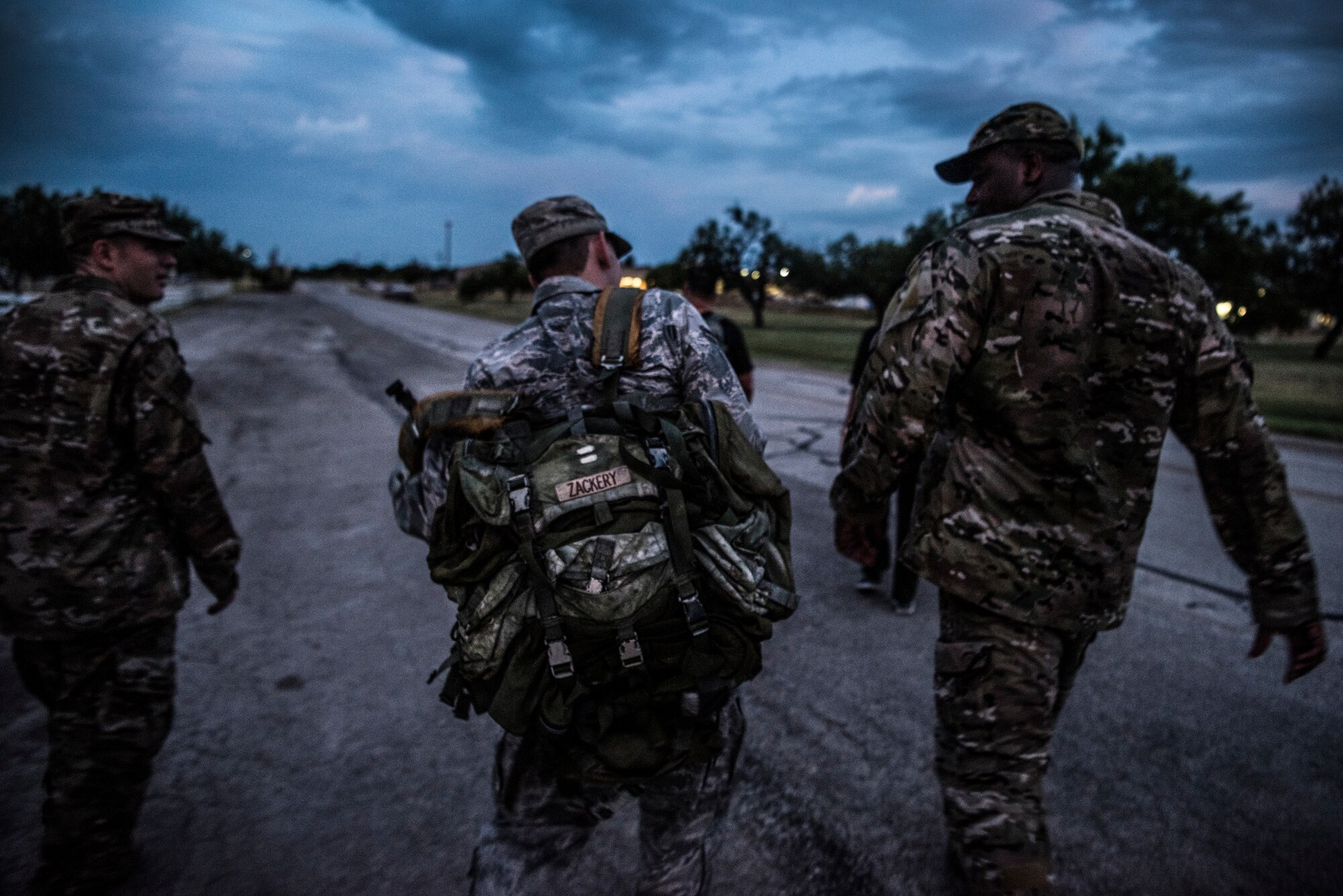 Airman 1st Class Justin Welch, 47th Flying Training Wing Command Post emergency actions controller, puts on a ruck pack during “Walk with the Chief” ruck march at Laughlin Air Force Base, Texas, July 23, 2019. “Walk with the Chief” is a monthly opportunity to interact with Laughlin’s command chief, Chief Master Sgt. Robert Zackery III, in a fun and informal setting, and prepare Airmen for a deployed environment. (U.S. Air Force photo by Airman 1st Class Marco A. Gomez)