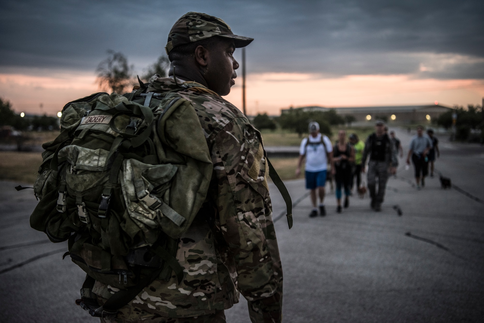 47th Flying Training Wing Command Chief Master Sgt. Robert Zackery III, waits for Airmen at the finish line during the “Walk with the Chief” ruck march on Laughlin Air Force Base, Texas. July 23, 2019. “Walk with the Chief” is a monthly opportunity to interact with Laughlin’s command chief, Chief Master Sgt. Robert Zackery III, in a fun and informal setting, and prepare Airmen for a deployed environment. (U.S. Air Force photo by Airman 1st Class Marco A. Gomez)