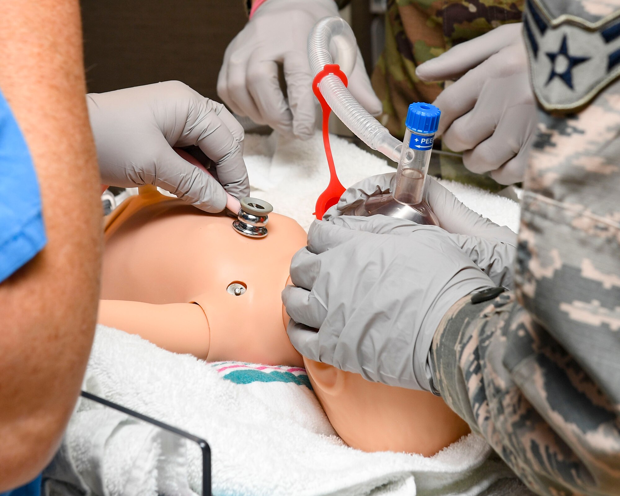 Airman 1st Class Monique Wood, 633rd Medical Group medical technician gives air to a Laerdal SimNewB simulator, July 10, 2019, at Joint Base Langley-Eustis, Virginia.