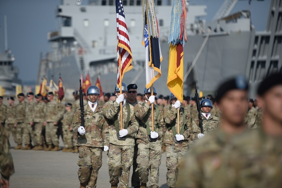 U.S. Army Color Guard Soldiers march with the colors during a 7th Transportation Brigade (Expeditionary) change of command ceremony at Joint Base Langley-Eustis, Virginia, July 18, 2019.