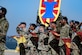 U.S. Army Soldiers assigned to the 7th Transportation Brigade (Expeditionary) salute  during a change of command ceremony at Joint Base Langley-Eustis, Virginia, July 18, 2019.