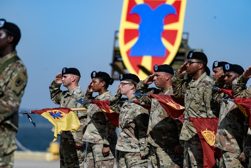 U.S. Army Soldiers assigned to the 7th Transportation Brigade (Expeditionary) salute  during a change of command ceremony at Joint Base Langley-Eustis, Virginia, July 18, 2019.