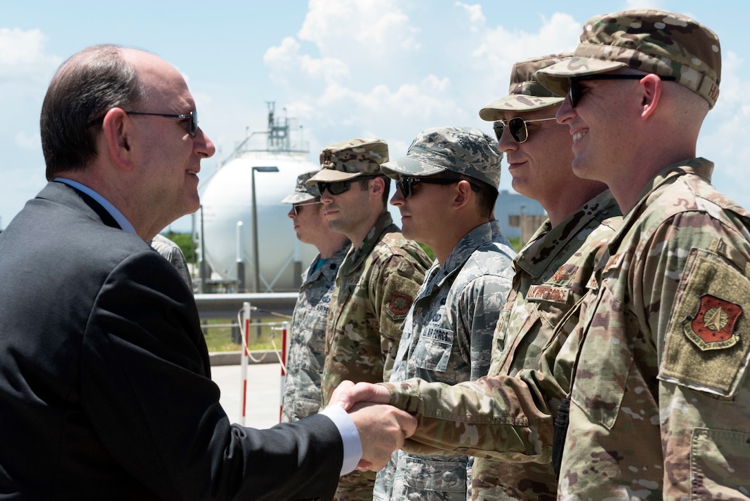 Acting Secretary of the Air Force Matthew Donovan shakes hands with a 45th Operations Group Airman on July 19, 2019, at Cape Canaveral Air Force Station, Fla. Donovan met with 45th OG Airmen to become more familiarized with the 45th Space Wing’s mission of providing space launch capabilities to the Nation and the warfighter. (U.S. Air Force photo by Airman 1st Class Zoe Thacker)