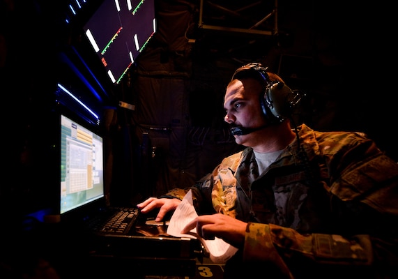 EC-130J Commando Solo systems operator monitors broadcast during mission in support of Operation Inherent Resolve at undisclosed location in Southwest Asia, September 5, 2017 (U.S. Air Force/Michael Battles)