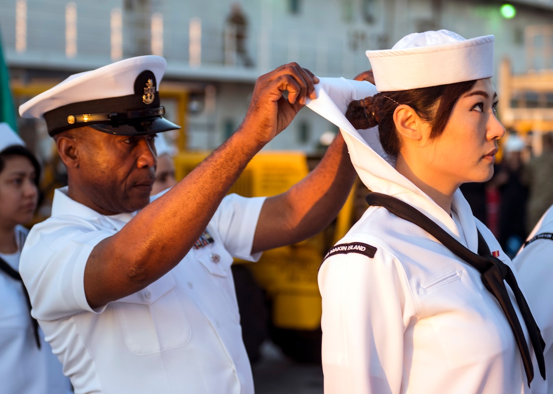Senior Chief Aviation Support Equipment Technician Augustine Ilomuanya, assigned to amphibious assault ship USS Makin Island, conducts dress white uniform inspection, San Diego, March 22, 2019 (U.S. Navy/Colby A. Mothershead)