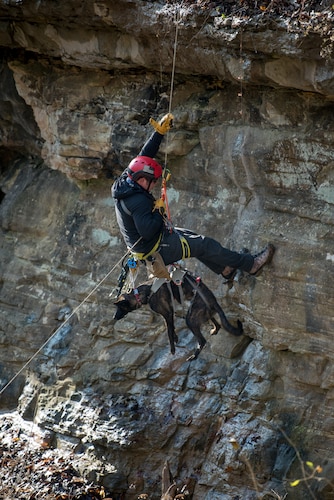 Tech. Sgt. Rudy Parsons, a pararescueman with the Kentucky Air National Guard’s 123rd Special Tactics Squadron, and his search and rescue dog, Callie, rappel down a cliff in Louisville, Ky., Dec. 7, 2108, as part of Callie’s familiarization training. Callie is currently the only search and rescue dog in the Department of Defense. (U.S. Air National Guard photo by Staff Sgt. Joshua Horton)
