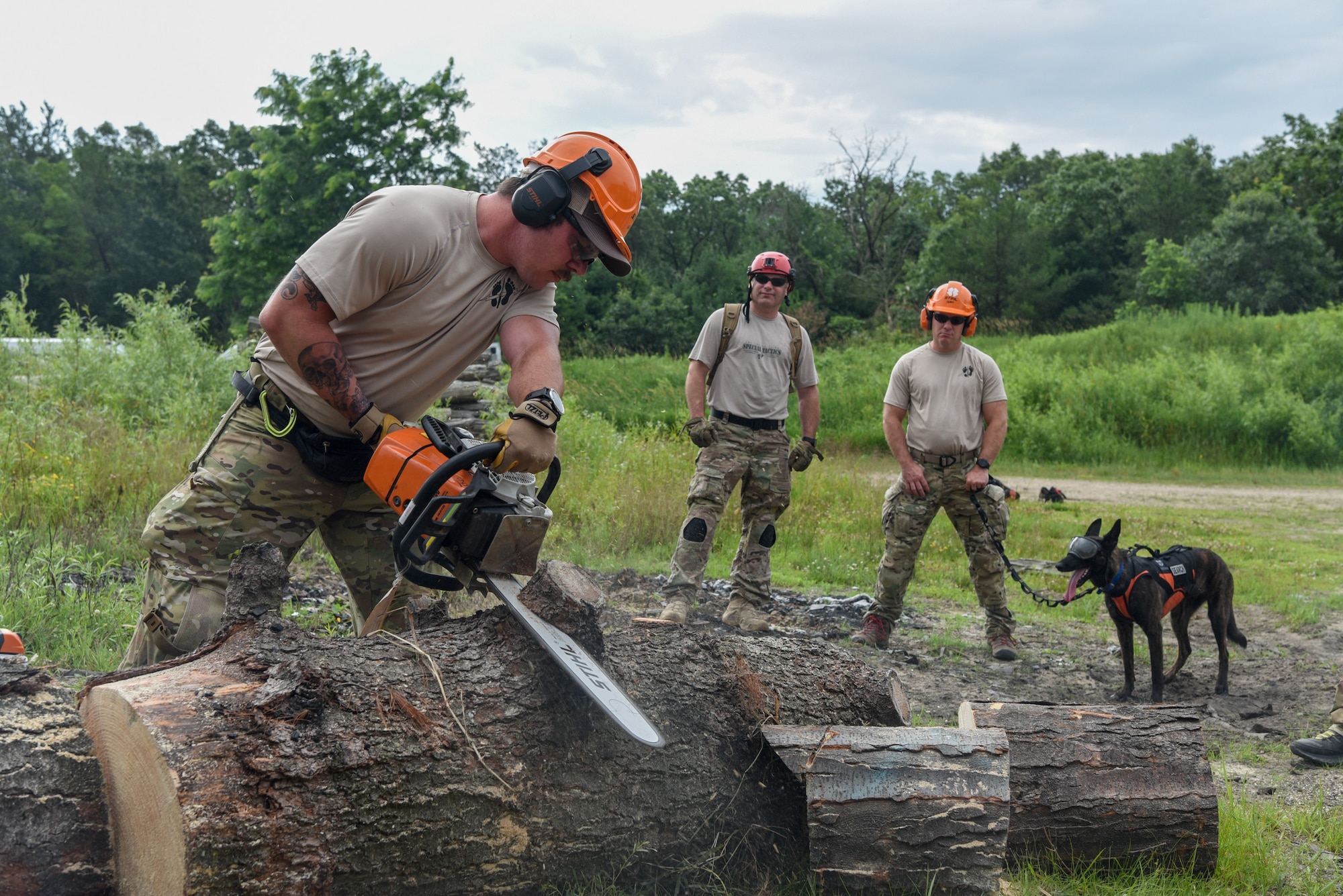 Master Sgt. Rudy Parsons, a pararescueman with the Kentucky Air National Guard’s 123rd Special Tactics Squadron, and Callie, his search and rescue dog, participate in Patriot North, an annual domestic operations exercise designed to provide natural disaster-response training at Volk Field, Wis., July 15, 2019. Callie is currently the only search and rescue dog in the Department of Defense. (U.S. Air National Guard photo by Staff Sgt. Joshua Horton
