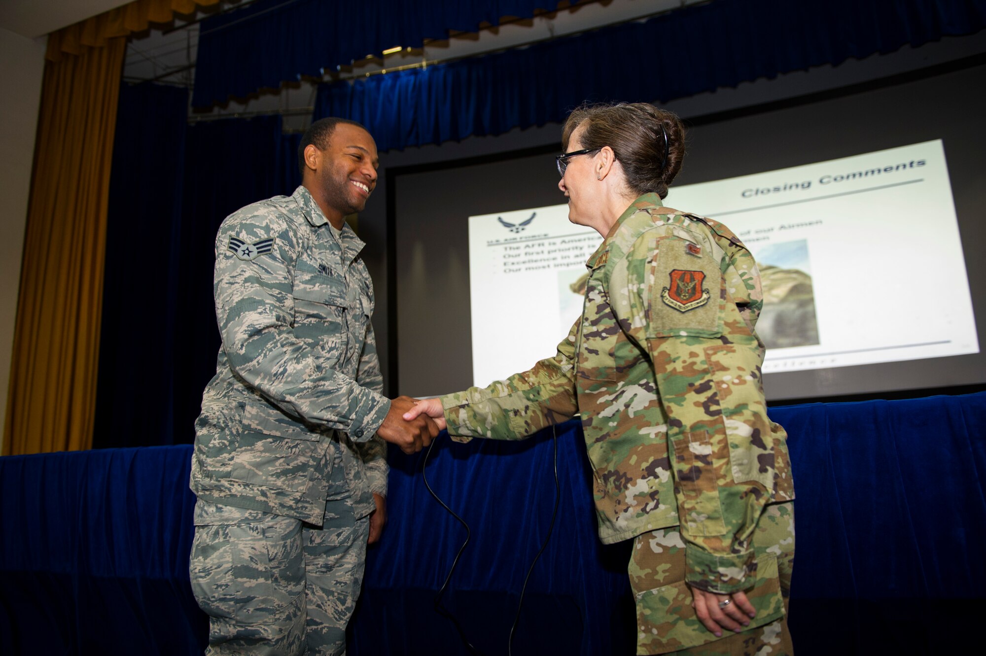 Senior Airman MC Smith, 926th Force Support Squadron Aurelia Hill, renders a salute to Col. Lisa Craig, Headquarters Air Force Reserve Command director of manpower, personnel and services, July 13,2019, at Nellis Air Force Base, Nev. Smith lend his expertise to the readiness mission by facilitating resources to ensure respected organizations have smooth transitions when deploying to their area of responsibility. Craig is responsible for policies, programs, and objectives involving readiness, assignments, education and training and the quality of life for Air Force reservists.
