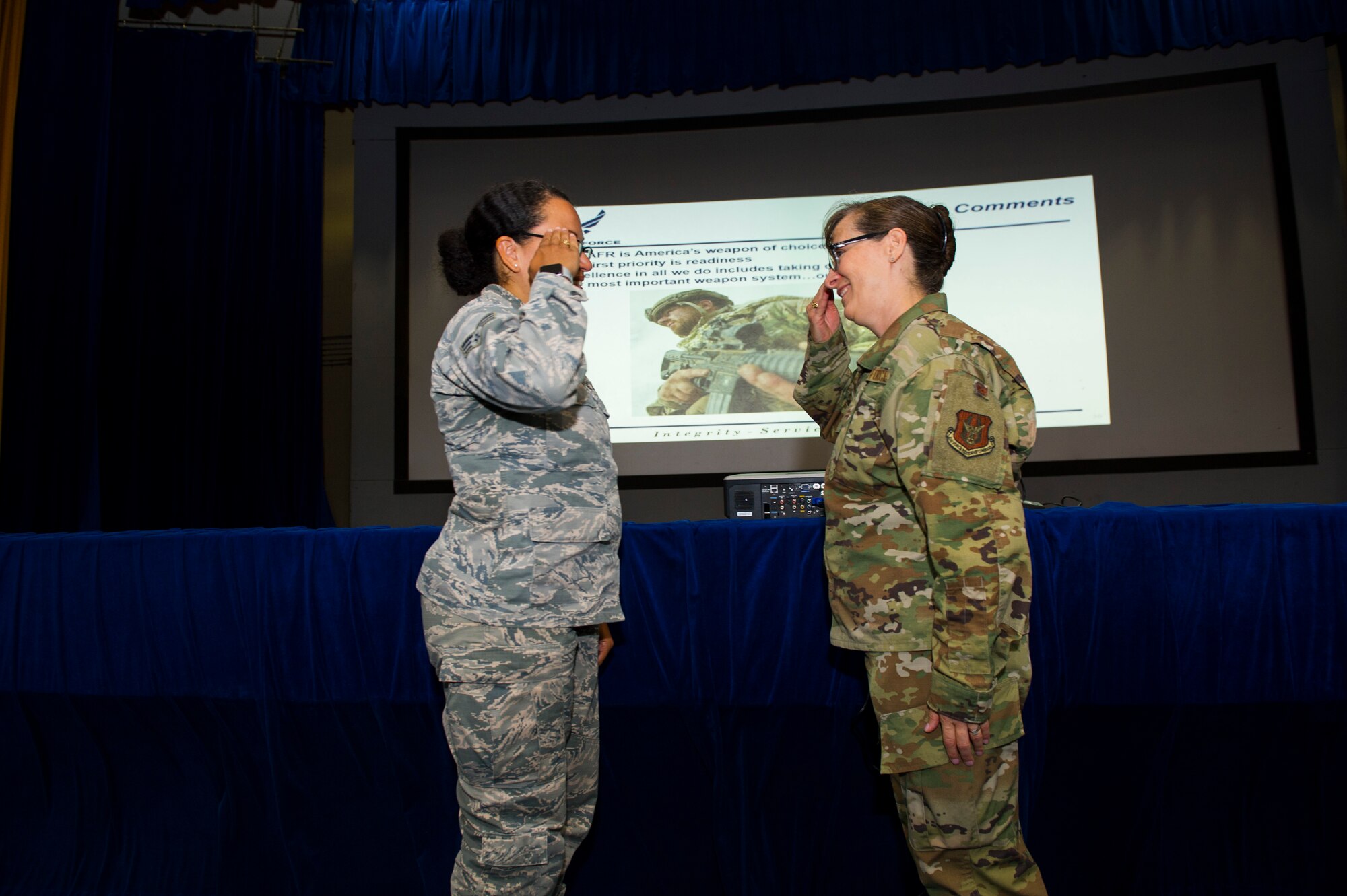 Senior Airman Aurelia Hill, 926th Force Support Squadron career development technician, renders a salute to Col. Lisa Craig, Headquarters Air Force Reserve Command director of manpower, personnel and services, July 13,2019, at Nellis Air Force Base, Nev. Hill accomplished multiple tasks to ensure effective readiness within the Wing. Smith was also recognized as the 926th Wing's Airman of the Quarter. Craig is responsible for policies, programs, and objectives involving readiness, assignments, education and training and the quality of life for Air Force reservists.