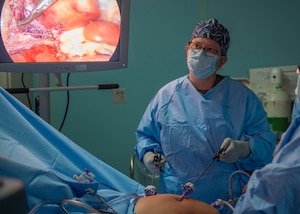 A doctor performs a surgery.