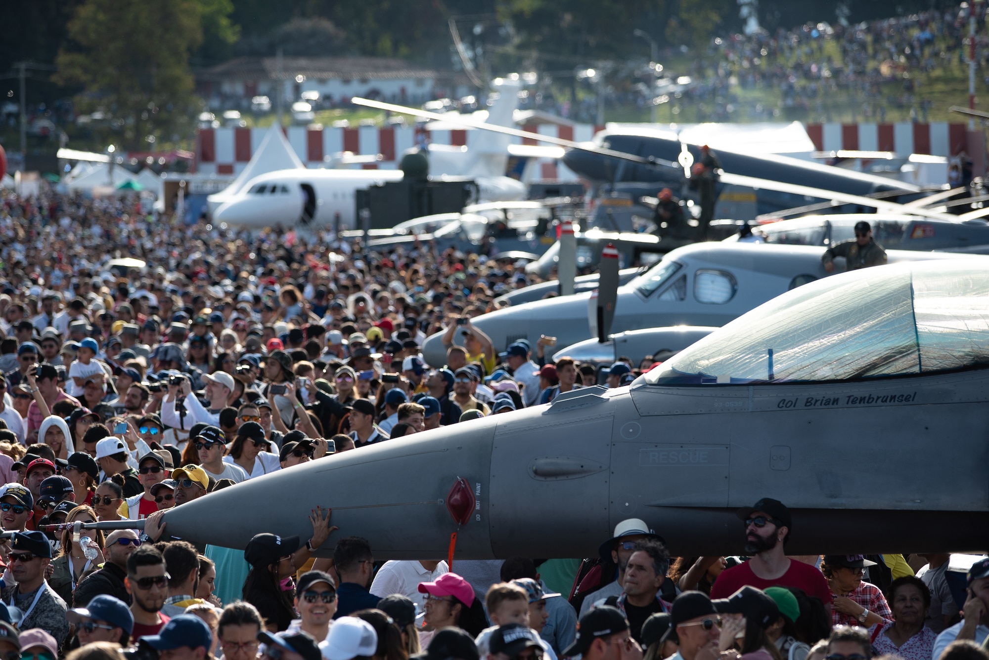 Visitors gather to watch an aerial demonstration during the Feria Aeronáutica Internacional—Colombia 2019 (F-AIR) at José María Córdova International Airport in Rionegro, Colombia, July 14, 2019.