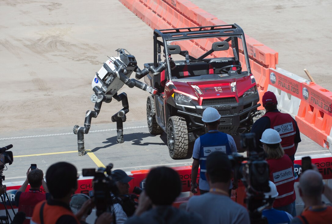 RoboSimian from Jet Propulsion Laboratory exits vehicle during DARPA Robotics Challenge, June 5, 2015, in Pomona, California (U.S. Navy/John F. Williams)