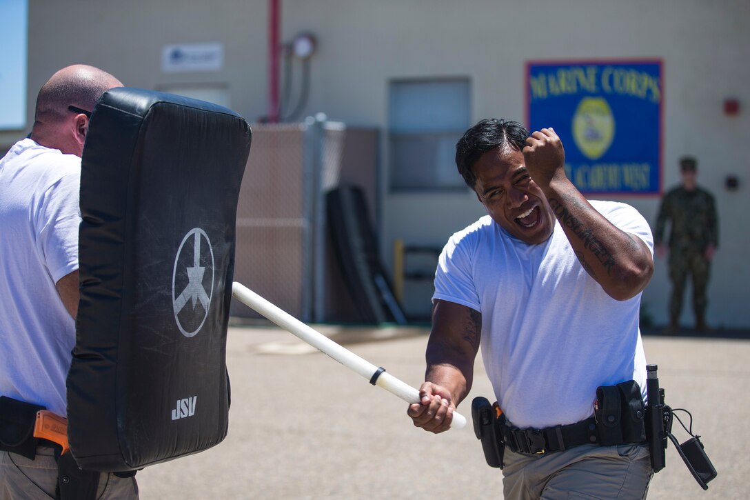 GS-4 Alex Jack, with the Marine Corps Air Ground Combat Center Twentynine Palms Provost Marshall’s Office, performs a forward baton strike at the Marine Corps Air Station Miramar Military Police Academy, Calif., July 19. The Marine Corps Police Academy at MCAS Miramar strives to provide highly qualified civilian and military police officers to ensure the security of the Marine Corps; it’s U.S. installations and the public's safety.