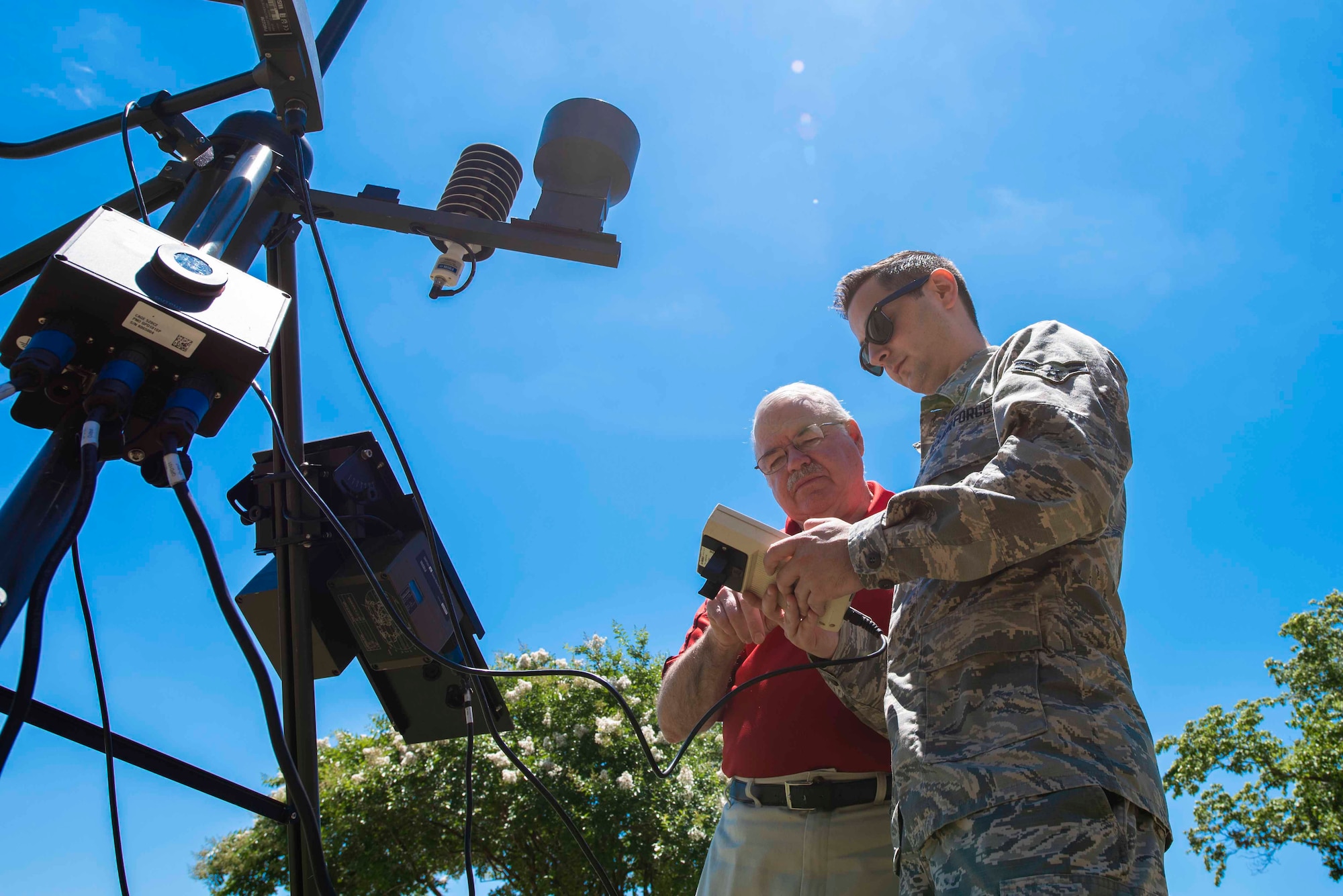 U.S. Air Force Airman 1st Class Mason Eggleston, 20th Operations Support Squadron weather flight forecaster, looks at different statistics for local weather at Shaw Air Force Base, South Carolina, June 21, 2019.