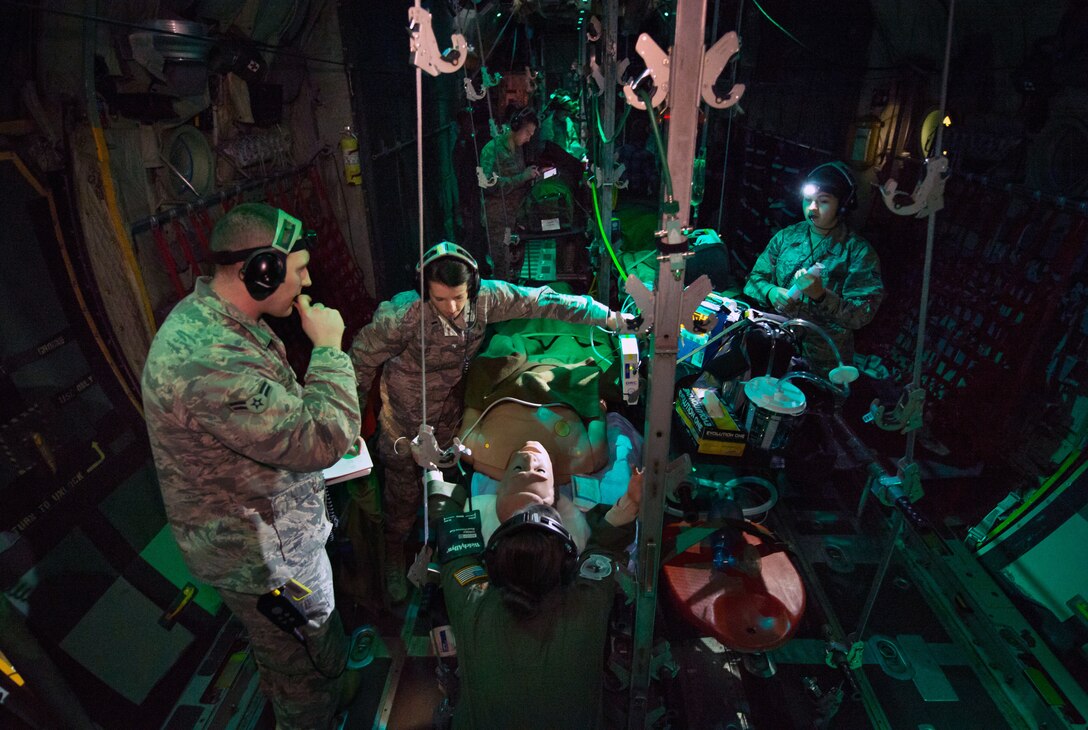 Flight nurse and aeromedical technician course students care for simulated patient during aeromedical evacuation mission aboard C-130 mockup at
Wright Patterson Air Force Base, Ohio, January 29, 2018 (U.S. Air Force/J.M. Eddins, Jr.)