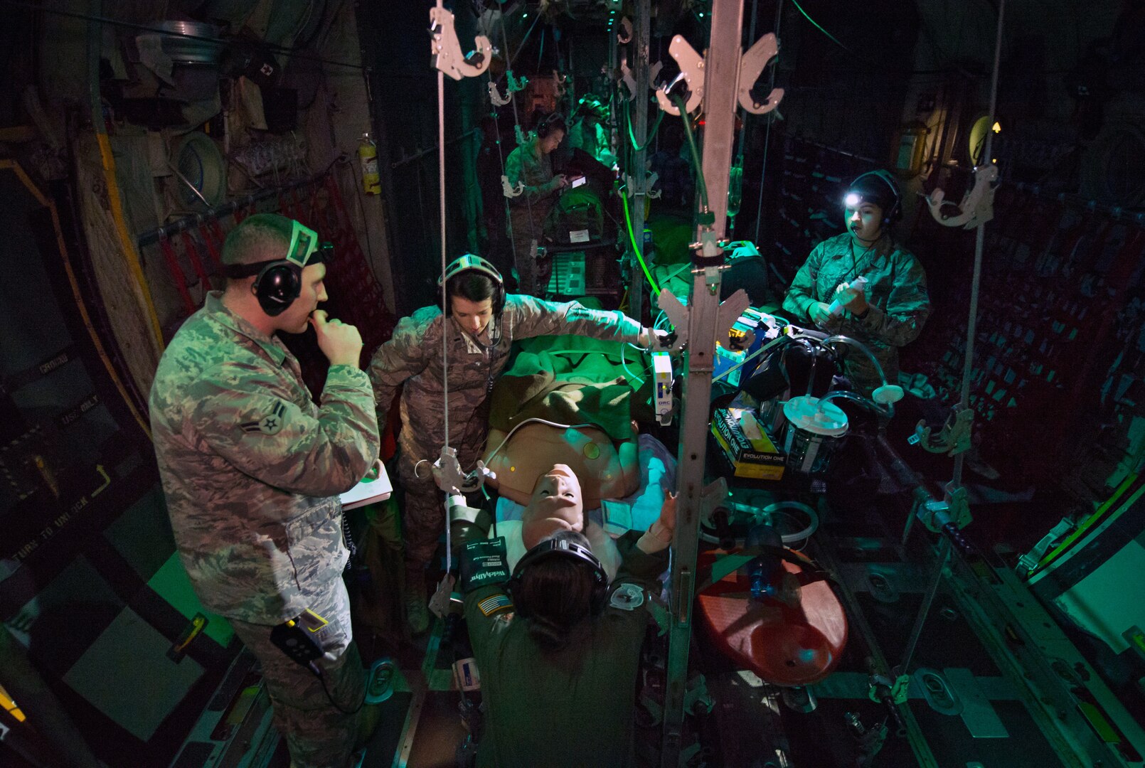 Flight nurse and aeromedical technician course students care for simulated patient during aeromedical evacuation mission aboard C-130 mockup at
Wright Patterson Air Force Base, Ohio, January 29, 2018 (U.S. Air Force/J.M. Eddins, Jr.)