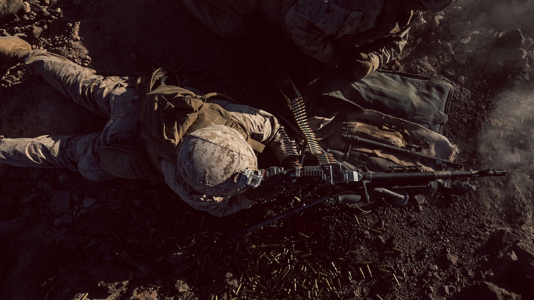 A U.S. Marine with Company I, 3rd Battalion, 7th Marine Regiment, 1st Marine Division, engages a target utilizing the M240G during a squad attack at Marine Corps Air Ground Combat Center, Twentynine Palms, Calif., July 15, 2019. The training was conducted to validate the squad leaders capabilities to lead and control their squads while integrating supporting arms in a deliberate attack.