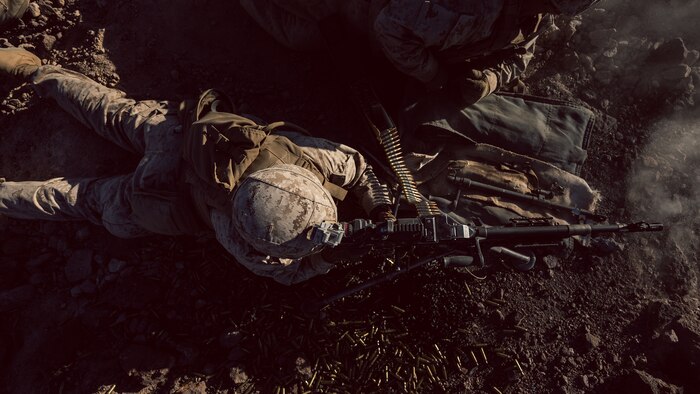 A U.S. Marine with Company I, 3rd Battalion, 7th Marine Regiment, 1st Marine Division, engages a target utilizing the M240G during a squad attack at Marine Corps Air Ground Combat Center, Twentynine Palms, Calif., July 15, 2019. The training was conducted to validate the squad leaders capabilities to lead and control their squads while integrating supporting arms in a deliberate attack.