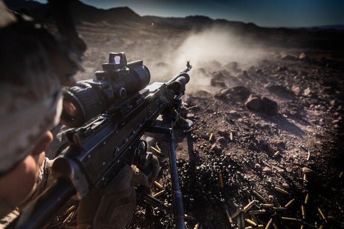 A U.S. Marine with Company I, 3rd Battalion, 7th Marine Regiment, 1st Marine Division, engages a target utilizing the M240G during a squad attack at Marine Corps Air Ground Combat Center, Twentynine Palms, Calif., July 15, 2019. The training was conducted to validate the squad leaders capabilities to lead and control their squads while integrating supporting arms in a deliberate attack.
