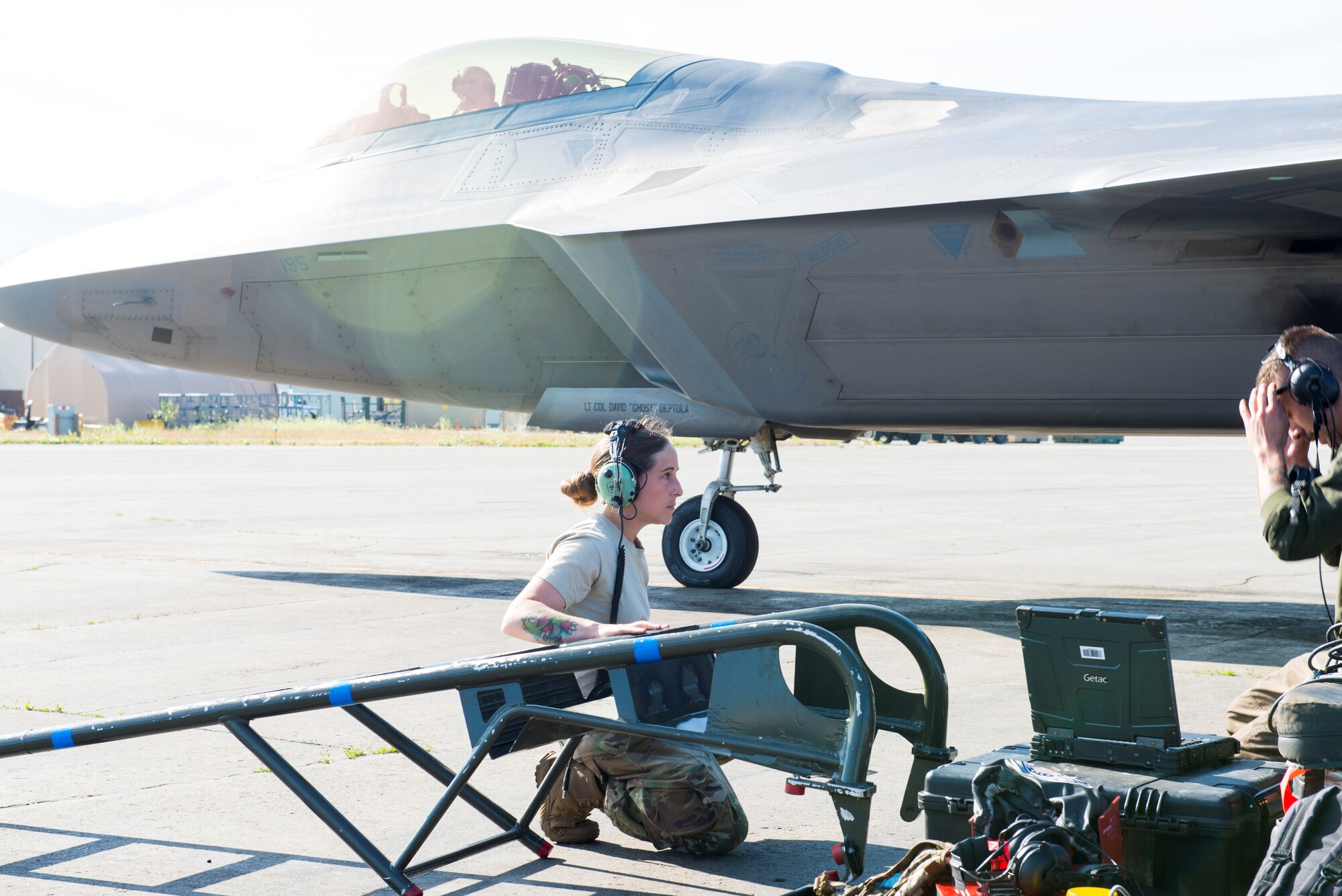 U.S. Air Force Senior Airman Carly Ranger, 673d Communications Squadron cyber transportation technician, shadows Air Force Senior Airman Michael Savvidis, 525th Aircraft Maintenance Unit.