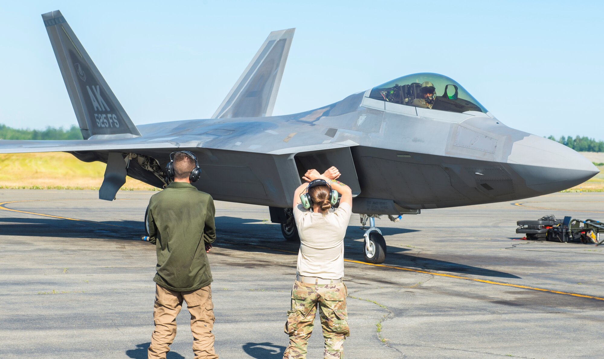 U.S. Air Force Senior Airman Carly Ranger, 673d Communications Squadron cyber transportation technician, shadows Air Force Senior Airman Michael Savvidis, 525th Aircraft Maintenance Unit.