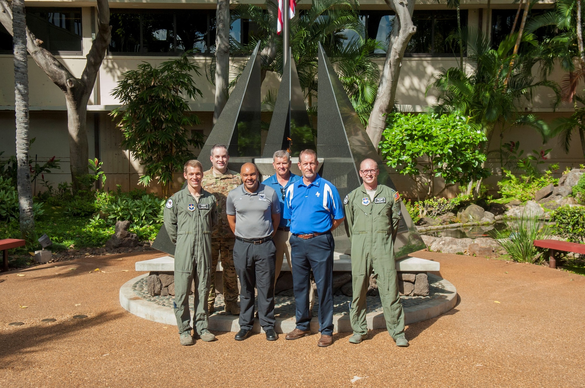 Members of the 12th Operations Support Squadron and 559th Flying Training Squadron, at Joint Base San Antonio-Randolph, Texas, pose for a group photo during a history tour at Headquarters Pacific Air Forces, Joint Base Pearl Harbor-Hickam, Hawaii, July 10, 2019. The purpose of the visit was for Air Education and Training Command (AETC) members to learn more about Pacific theater operations and build and a relationship between AETC as a major command (MAJCOM) and PACAF as a combatant command (COCOM).