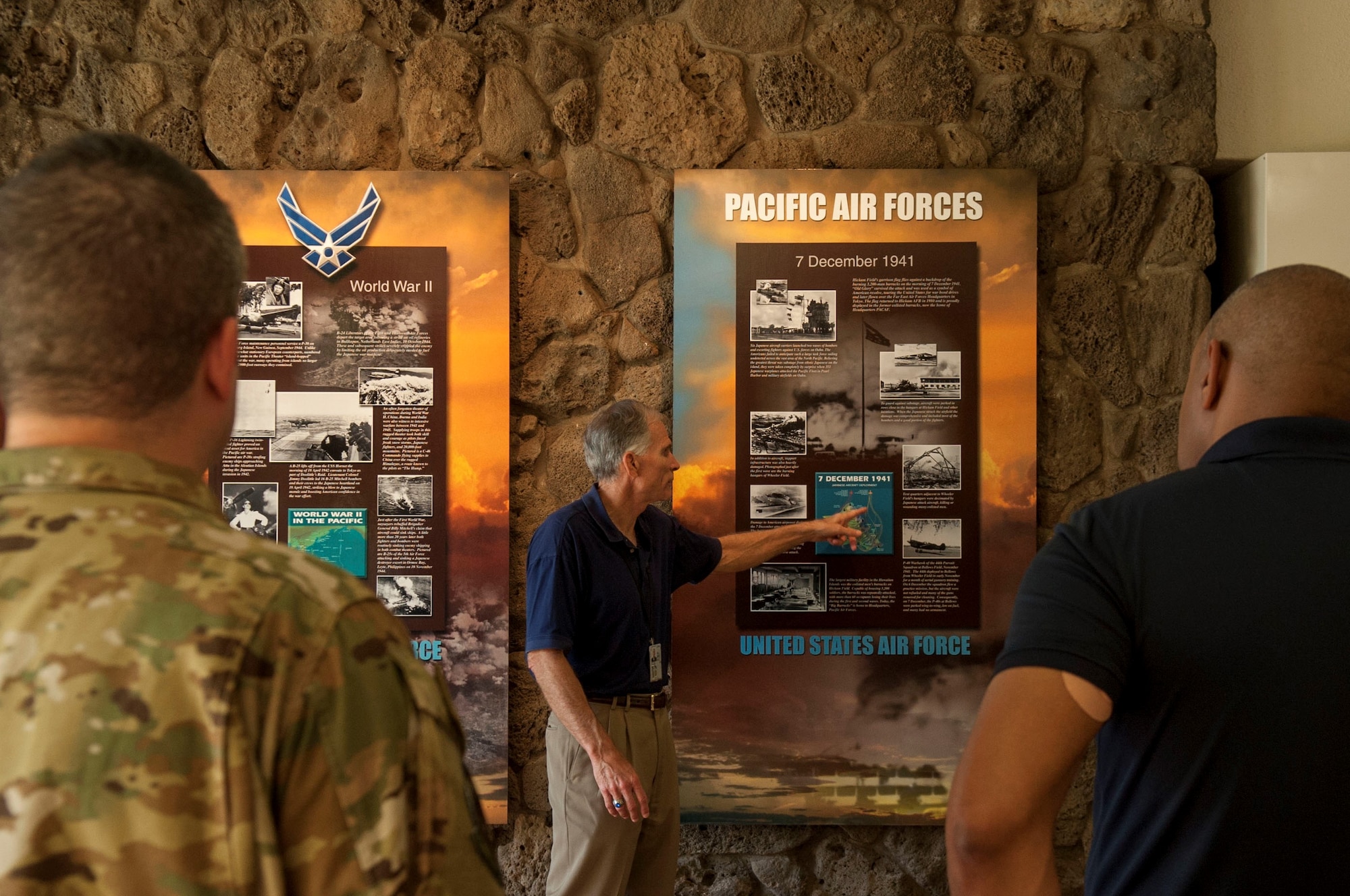 Charles Nicholls, Pacific Air Forces (PACAF) historian, gives an account of the Pearl Harbor attack for members of the 12th Operations Support Squadron and 559th Flying Training Squadron, from Joint Base San Antonio-Randolph, Texas, during a history tour at Headquarters PACAF, Joint Base Pearl Harbor-Hickam, Hawaii, July 10, 2019. The purpose of the visit was for Air Education and Training Command (AETC) members to learn more about Pacific theater operations and build and a relationship between AETC as a major command (MAJCOM) and PACAF as a combatant command (COCOM).