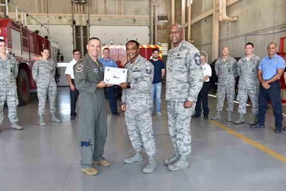 Technical Sgt. Nathaniel Andrews, 47th Civil Engineer Squadron assistant fire chief, was chosen by wing leadership to be the “XLer” of the week, for the week of July 15, 2019, at Laughlin Air Force Base, Texas. The “XLer” award, presented by Col. Lee Gentile, 47th Flying Training Wing commander and Chief Master Sgt. Ronald Harper, 47th Mission Support Group superintendent, is given to those who consistently make outstanding contributions to their unit and the Laughlin mission. (U.S. Air Force photo by Staff Sgt. Benjamin N. Valmoja)