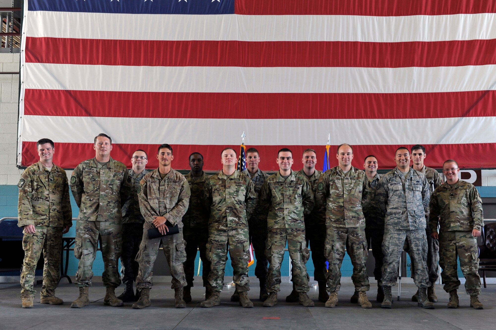 U.S. Air Force Lt. Col. Frederic Lathrop, 71st Special Operation Squadron director of operations (left) and Lt. Col. Lt. Col. Scott Ruppel, 58th Aircraft Maintenance Squadron commander (right), pose with dedicated and assistant dedicated crew chiefs from the 71st Aircraft Maintenance Unit during a ceremony at Kirtland Air Force Base, N.M., July 19, 2019. More than 20 members of the 415th and 71st AMUs were recognized during the ceremony. These dedicated and assistant dedicated crew chiefs will now have their names put on the aircraft assigned to them and are responsible for all maintenance done on that aircraft. (U.S. Air Force photo by Staff Sgt. Dylan Nuckolls)