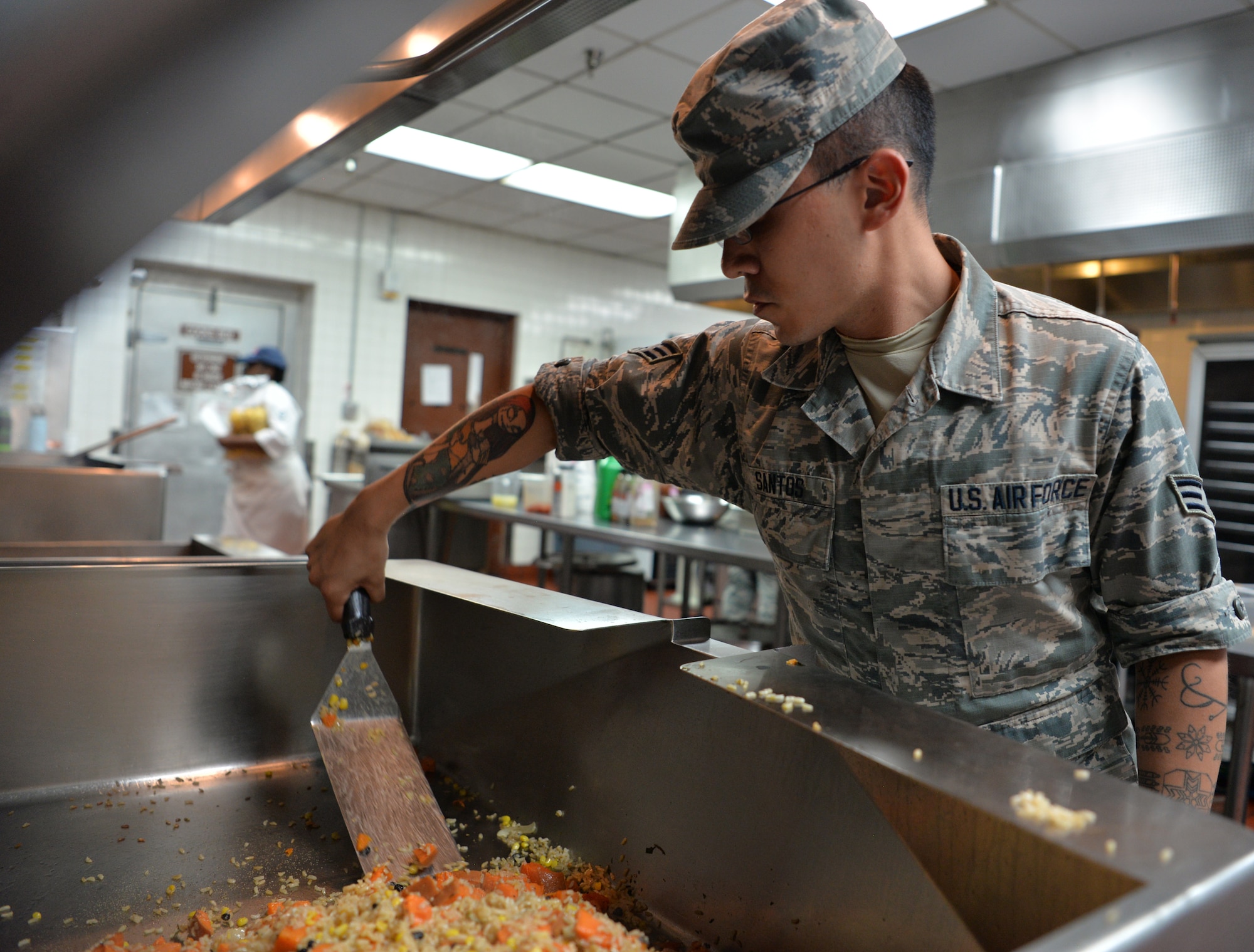 Senior Airman Joseph Santos, 99th Force Support Squadron food service journeyman, prepares lunch for service members during Red Flag 19-3 at Nellis Air Force Base, Nev., July 18, 2019. Red Flag is a combat training exercise involving the U.S. Air Force and its joint and coalition partners. (U.S. Air Force photo by Tech. Sgt. Bryan Magee)
