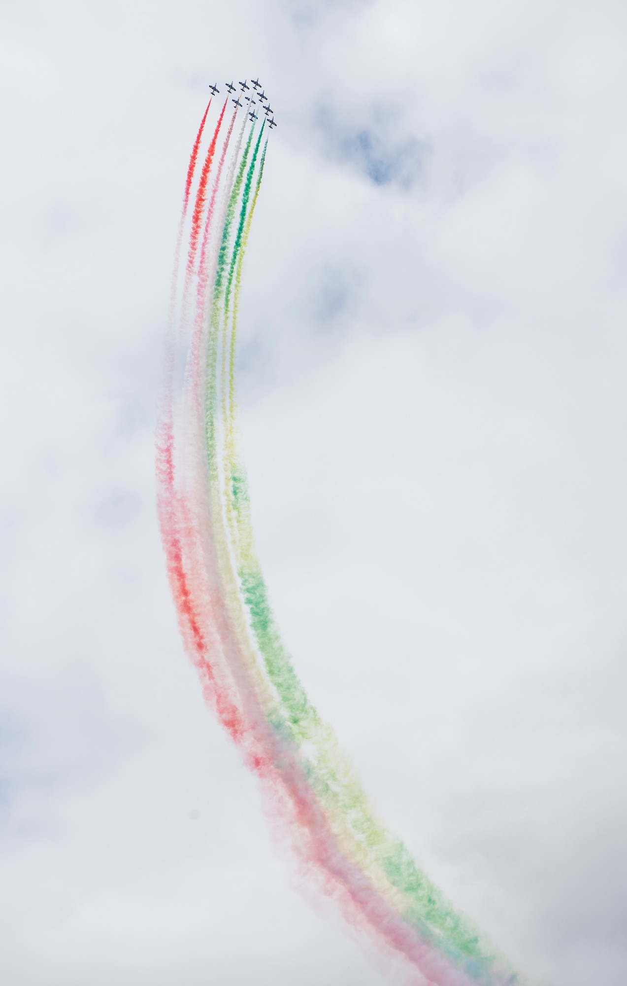 Several members of the Italian Air Force’s Frecce Tricolori aerobatic team conduct aerial maneuvers during the 2019 Royal International Air Tattoo at RAF Fairford, England, July 20, 2019. This year, RIAT commemorated the 70th anniversary of NATO and highlighted the United States' enduring commitment to its European allies. (U.S. Air Force photo by Airman 1st Class Jennifer Zima)